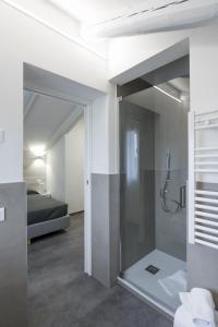a bathroom with a shower with a glass door at Boutique Hotel Nuovo Cason in Cavallino-Treporti