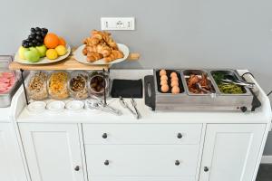a buffet with plates of food and other foods at Boutique Hotel Nuovo Cason in Cavallino-Treporti