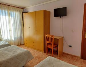 Кровать или кровати в номере Hostal Castilla