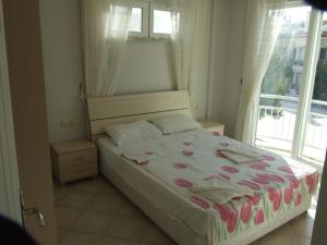 Postel nebo postele na pokoji v ubytování Sunset Beach Club