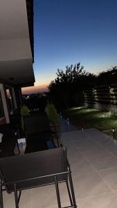 a patio with a bench and a view of the city at Studio 8 Arapya in Tsarevo