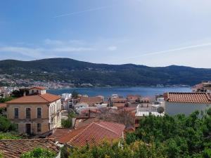 a view of a town with a lake in the background at Stonehouse with wonderful seaview in Samos
