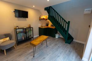 A television and/or entertainment centre at Stay Barrow Blueway - The Stables