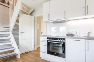 Kuchyň nebo kuchyňský kout v ubytování Haus Weesterhuk Whg 10