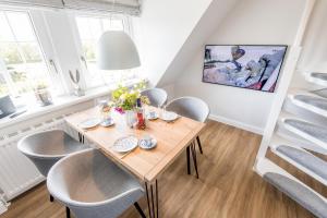 TV a/nebo společenská místnost v ubytování Haus Weesterhuk Whg 10