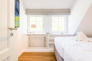 Postel nebo postele na pokoji v ubytování Haus Weesterhuk Whg 10