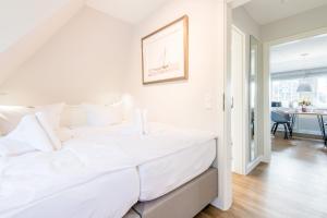 Postel nebo postele na pokoji v ubytování Haus Weesterhuk Whg 10 + 22 fotografií