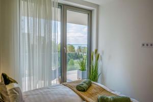 Posteľ alebo postele v izbe v ubytovaní MyFlat Coral 64 Premium Apartment