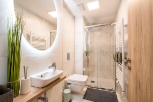 Kúpeľňa v ubytovaní MyFlat Coral 64 Premium Apartment