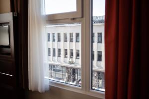 a view of a building from a window at Ibis Kaunas Centre in Kaunas