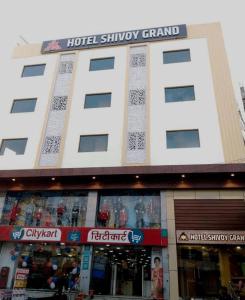 a building with a hotel survey channel sign on it at HOTEL SHIVOY GRAND in Varanasi