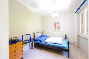 a small bedroom with a bed and a dresser at Diana Villa in Oggebbio