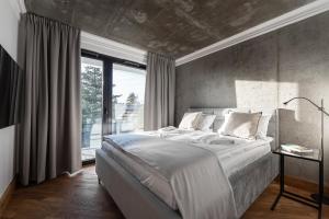 Posteľ alebo postele v izbe v ubytovaní Apartamenty Przystanek Przy Klifie