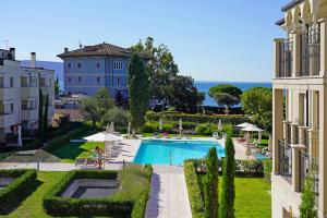 a view of a pool from a building at Corte Fasanella 78 in Toscolano Maderno