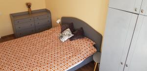 Postel nebo postele na pokoji v ubytování Ventspilio apartamentai