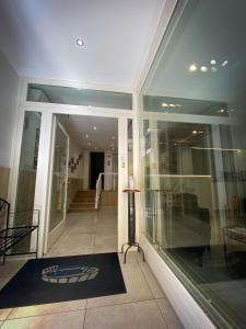 a store front with a window and a black rug at Hotel Arena in Verona