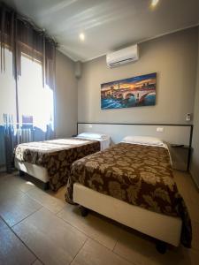 Postel nebo postele na pokoji v ubytování Hotel Arena