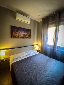 Postel nebo postele na pokoji v ubytování Hotel Arena + 35 fotografií