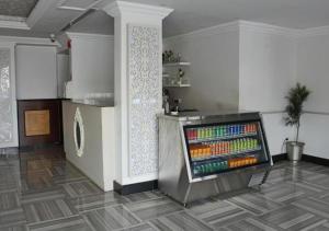 a room with a drink cooler in the corner of a room at Tobal Al Hamra Hotel Apartments in Jeddah