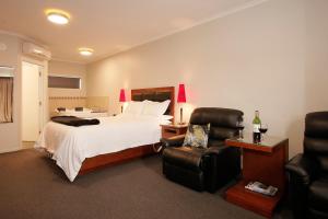 מיטה או מיטות בחדר ב-City Corporate Motor Inn