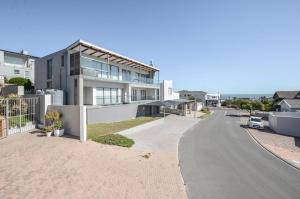an empty street in front of a house at 21 Flamingo House in Yzerfontein