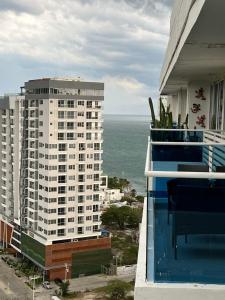 a balcony of a building with a view of the ocean at Edificio Reserva del Mar, Paya Salguero , Santa marta in Gaira