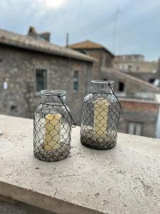 two glass vases sitting on top of a table at Serena e’ in Viterbo