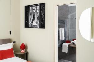 a bedroom with a shower and a bed and a mirror at InCanto in Palermo +76 photos