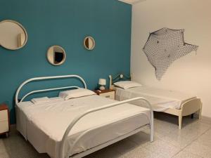 Posteľ alebo postele v izbe v ubytovaní La Casa di Stefania 3 Porto Cesareo