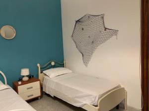Posteľ alebo postele v izbe v ubytovaní La Casa di Stefania 3 Porto Cesareo