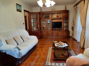 TV a/nebo společenská místnost v ubytování Casa do Paço