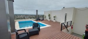 a balcony with a swimming pool on top of a building at Fenix 4 in Formosa