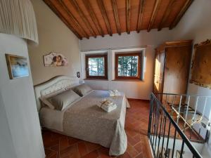 A bed or beds in a room at BELLA TUSCANY - Residence