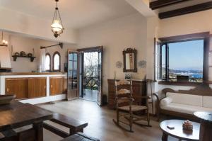 A seating area at Villa Mitsa with stunning view on the Argassi hill