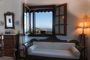 A seating area at Villa Mitsa with stunning view on the Argassi hill