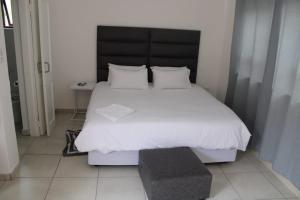 Un pat sau paturi într-o cameră la Connesione Mogwase