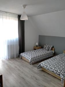 Posteľ alebo postele v izbe v ubytovaní u Iwony na Kaszubach