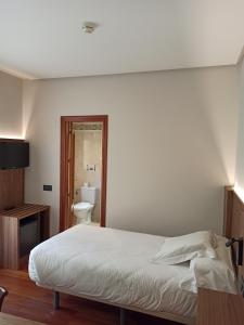 Postel nebo postele na pokoji v ubytování ARVA Spa París