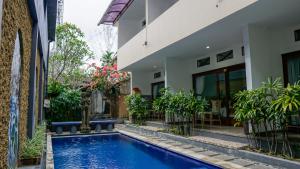 Bazén v ubytování Pondok Pekak Guesthouse nebo v jeho okolí