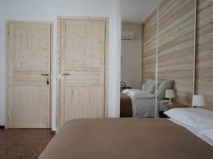 Postel nebo postele na pokoji v ubytování B&B Porto Del Bivio