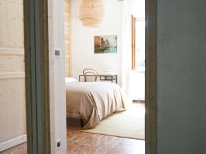Postel nebo postele na pokoji v ubytování B&B Porto Del Bivio