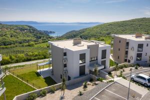 an image of a building with a view of the water at Royal Hilltop Residence in Labin