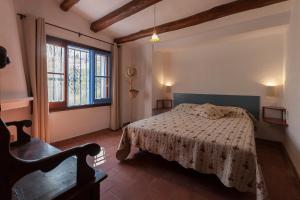 a bedroom with a bed and a window at Let's Holidays 7 Xemeneies house in Tossa de Mar +46 photos