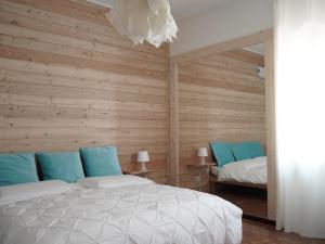Postel nebo postele na pokoji v ubytování B&B Porto Del Bivio