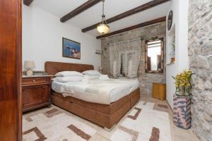 Katil atau katil-katil dalam bilik di Heritage Palace LIŠTUN
