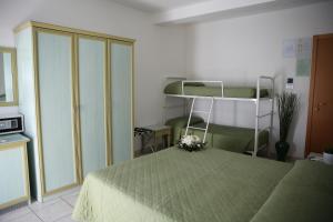 a bedroom with a bed and a bunk bed at Hotel Philadelphia in Cattolica +56 photos