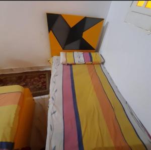 Postel nebo postele na pokoji v ubytování Aziza House