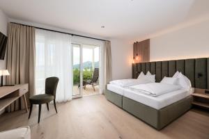 Postel nebo postele na pokoji v ubytování Hotel Stadler am Attersee