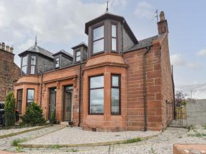 an old brick house with a turret at Willowbank in Ayr