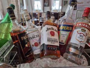 a group of bottles of alcohol on a table at Rathaushotels Oberwiesenthal All Inclusive in Kurort Oberwiesenthal